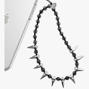 Velvet Caviar black studded phone wrist strap